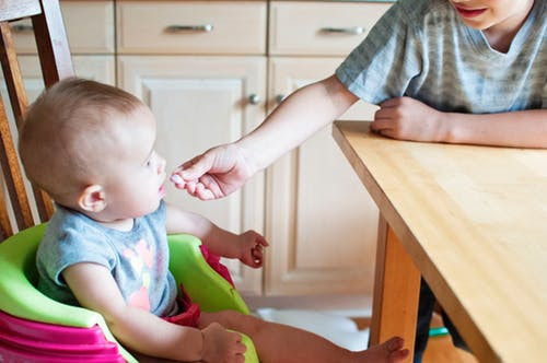 Baby eating her meal. 