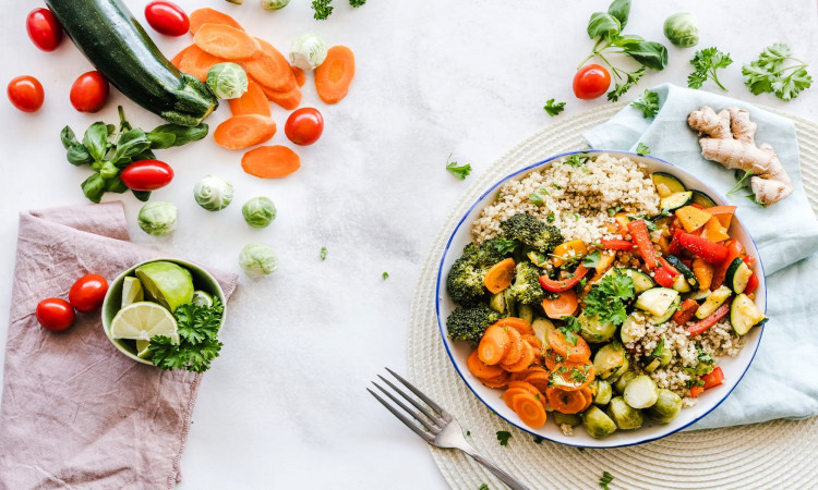 Vegetable and salad on plate.