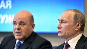 Russian President Vladimir Putin attends a meeting with head of the Federal Taxation Service Mikhail Mishustin in Moscow