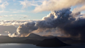 The errupting Taal Volcano is seen at sunrise in Tagaytay City