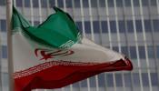 An Iranian flag flutters in front of the International Atomic Energy Agency (IAEA) headquarters in Vienna