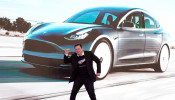 Tesla Inc CEO Elon Musk dances onstage during a delivery event for Tesla China-made Model 3 cars in Shanghai