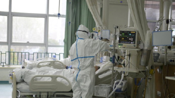 A picture released by the Central Hospital of Wuhan shows medical staff attending to patient at the The Central Hospital Of Wuhan