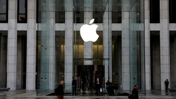 The Apple Inc. logo is seen hanging at the entrance to the Apple store on 5th Avenue in New York
