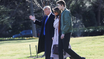 U.S. President Donald Trump and First Lady Melania Trump walk with their son Barron to the Marine One helicopter to depart for travel to Florida from the South Lawn of the White House in Washington, U.S., January 17, 2020. REUTERS/Leah Millis