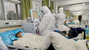 Picture uploaded to social media on January 25, 2020 by the Central Hospital of Wuhan show medical staff attending to patients, in Wuhan, China. 