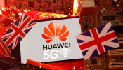 The British flag and a smartphone with a Huawei and 5G network logo are seen on a PC motherboard in this illustration picture