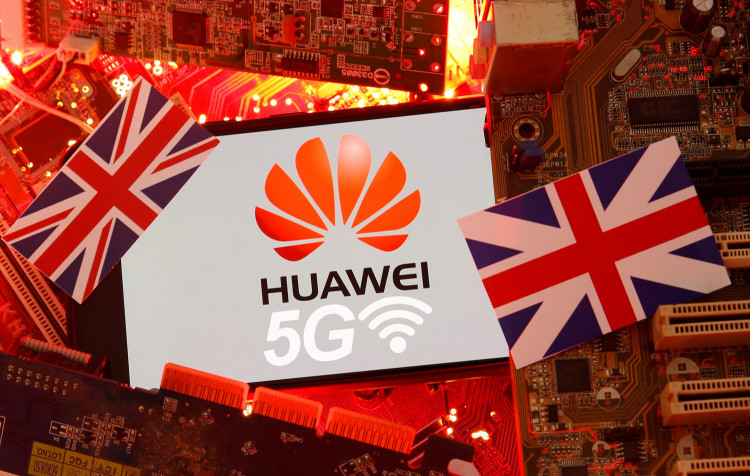 The British flag and a smartphone with a Huawei and 5G network logo are seen on a PC motherboard in this illustration picture
