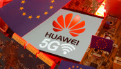 FILE PHOTO: The EU flag and a smartphone with the Huawei and 5G network logo are seen on a PC motherboard in this illustration