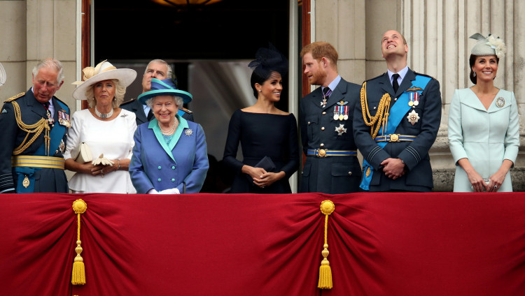 FILE PHOTO: Britain's Queen Elizabeth is joined by members of the Royal Family on the balcony of Buckingham Palace as they watch a fly past to mark the centenary of the Royal Air Force in central London