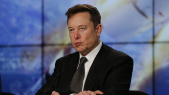SpaceX founder and chief engineer Elon Musk reacts at a post-launch news conference to discuss the SpaceX Crew Dragon astronaut capsule in-flight abort test at the Kennedy Space Center