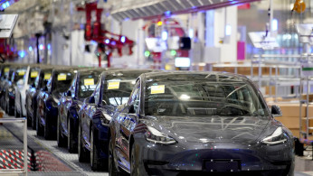 Tesla China-made Model 3 vehicles are seen during a delivery event at its factory in Shanghai, China