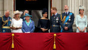 FILE PHOTO: Britain's Queen Elizabeth is joined by members of the Royal Family on the balcony of Buckingham Palace as they watch a fly past to mark the centenary of the Royal Air Force in central London