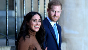 FILE PHOTO: Britain's Prince Harry and his wife Meghan, Duchess of Sussex react as they leave after their visit to Canada House in London, Britain January 7, 2020. Daniel Leal-Olivas/Pool via REUTERS/File Photo