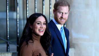 FILE PHOTO: Britain's Prince Harry and his wife Meghan, Duchess of Sussex react as they leave after their visit to Canada House in London, Britain January 7, 2020. Daniel Leal-Olivas/Pool via REUTERS/File Photo