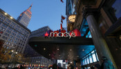 People wait to enter Macy's Herald Square ahead of early opening for the Black Friday sales in Manhattan, New York City