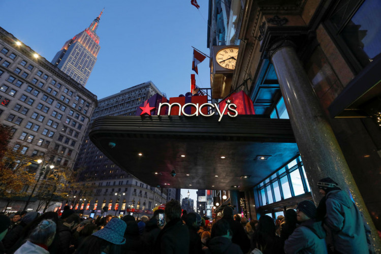 People wait to enter Macy's Herald Square ahead of early opening for the Black Friday sales in Manhattan, New York City