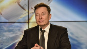 SpaceX founder and chief engineer Elon Musk reacts at a post-launch news conference to discuss the SpaceX Crew Dragon astronaut capsule in-flight abort test at the Kennedy Space Center