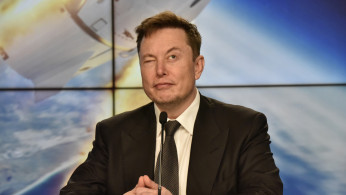 SpaceX founder and chief engineer Elon Musk reacts at a post-launch news conference to discuss the SpaceX Crew Dragon astronaut capsule in-flight abort test at the Kennedy Space Center