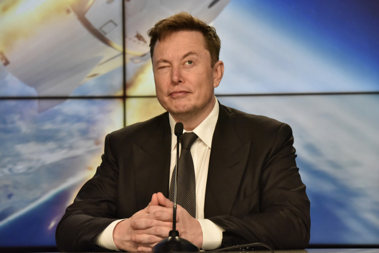 SpaceX founder and chief engineer Elon Musk reacts at a post-launch news conference to discuss the SpaceX Crew Dragon astronaut capsule in-flight abort test at the Kennedy Space Center