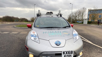 A modified Nissan Leaf driverless car is seen parked outside Nissan's Technical Centre in Cranfield