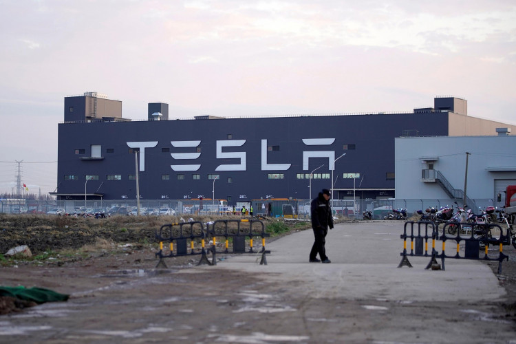 A Tesla sign is seen on the Shanghai Gigafactory of the U.S. electric car maker before a delivery ceremony in Shanghai, China January 7, 2020. 