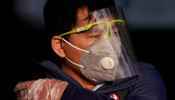 A man wearing a mask is seen at the Shanghai railway station in Shanghai, China, as the country is hit by an outbreak of the novel coronavirus