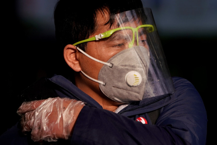A man wearing a mask is seen at the Shanghai railway station in Shanghai, China, as the country is hit by an outbreak of the novel coronavirus