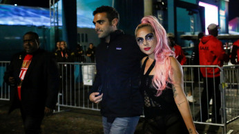 NFL Football - Super Bowl LIV - Kansas City Chiefs v San Francisco 49ers - Hard Rock Stadium, Miami Gardens, Florida, U.S. - February 2, 2020. Lady Gaga and Michael Polansky leave after the game. REUTERS/Marco Bello