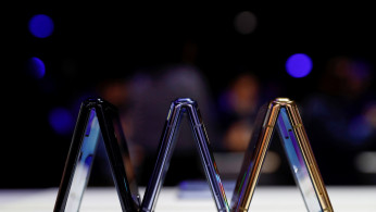 A trio of Samsung Galaxy Z Flip foldable smartphones is seen during Samsung Galaxy Unpacked 2020 in San Francisco