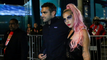 NFL Football - Super Bowl LIV - Kansas City Chiefs v San Francisco 49ers - Hard Rock Stadium, Miami Gardens, Florida, U.S. - February 2, 2020. Lady Gaga and Michael Polansky leave after the game. REUTERS/Marco Bello