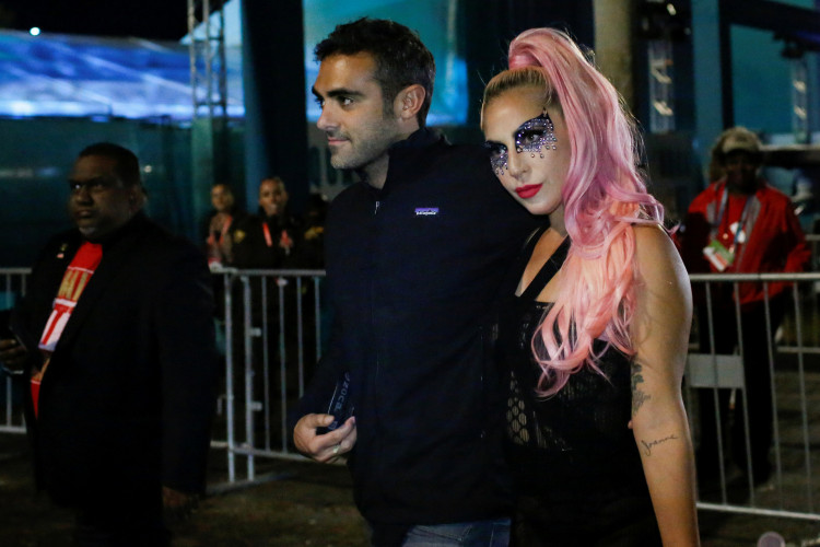 NFL Football - Super Bowl LIV - Kansas City Chiefs v San Francisco 49ers - Hard Rock Stadium, Miami Gardens, Florida, U.S. - February 2, 2020. Lady Gaga and Michael Polansky leave after the game. REUTERS/Marco Bello