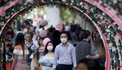 A couple celebrate Valentine's Day as they wear face masks in precaution of the coronavirus outbreak at Orchard Road in Singapore