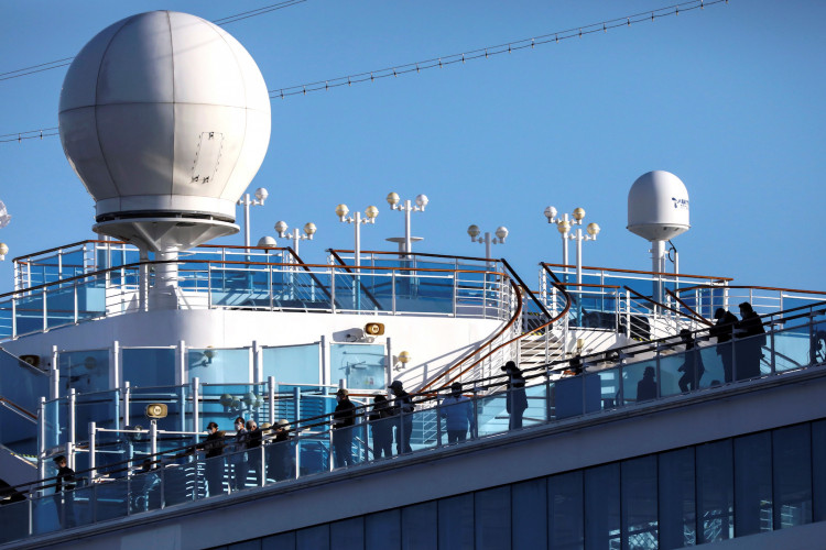 Passengers are seen on the cruise ship Diamond Princess, as the vessel's passengers continue to be tested for coronavirus, at Daikoku Pier Cruise Terminal in Yokohama, south of Tokyo
