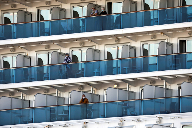 Passengers are seen on the cruise ship Diamond Princess, as the vessel's passengers continue to be tested for coronavirus, at Daikoku Pier Cruise Terminal in Yokohama, south of Tokyo