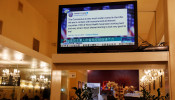 A tweet by U.S. Donald Trump regarding the coronavirus is seen on a Chinese television station inside a restaurant in the Chinatown section of San Francisco, California