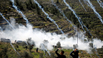 Tear gas canisters are fired by Israeli forces towards Palestinian demonstrators during a protest against Israeli settlements and Trump's Middle East peace plan, in Beita town in the Israeli-occupied West Bank