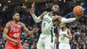 NBA: Milwaukee Bucks guard Wesley Matthews (9) reaches for the ball against Philadelphia 76ers forward Glenn Robinson III 