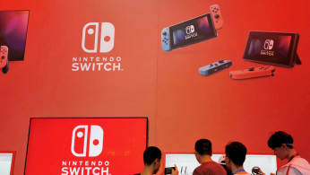 Visitors are seen at a booth of Nintendo Switch at the China Digital Entertainment Expo and Conference in Shanghai, China August 2, 2019. 