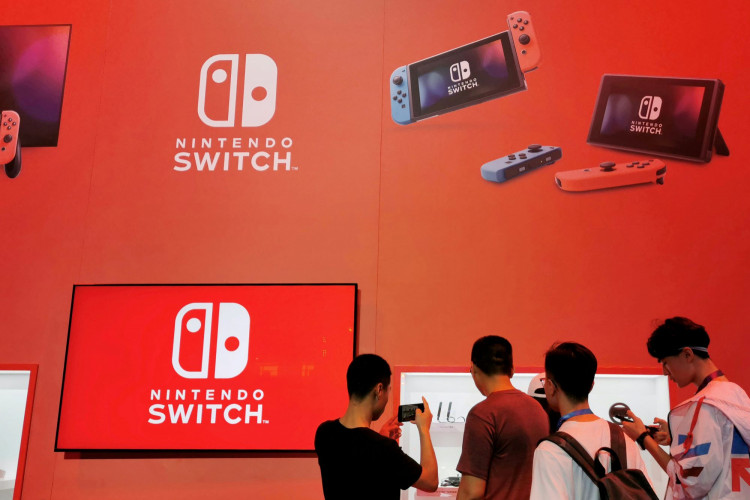 Visitors are seen at a booth of Nintendo Switch at the China Digital Entertainment Expo and Conference in Shanghai, China August 2, 2019. 