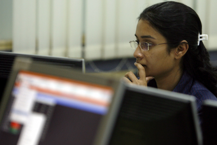 A broker looks at her computer terminal at a stock brokerage firm in Mumbai May 4, 2009. 