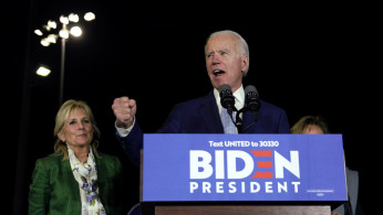 Democratic U.S. presidential candidate and former Vice President Joe Biden addresses supporters with his wife Jill