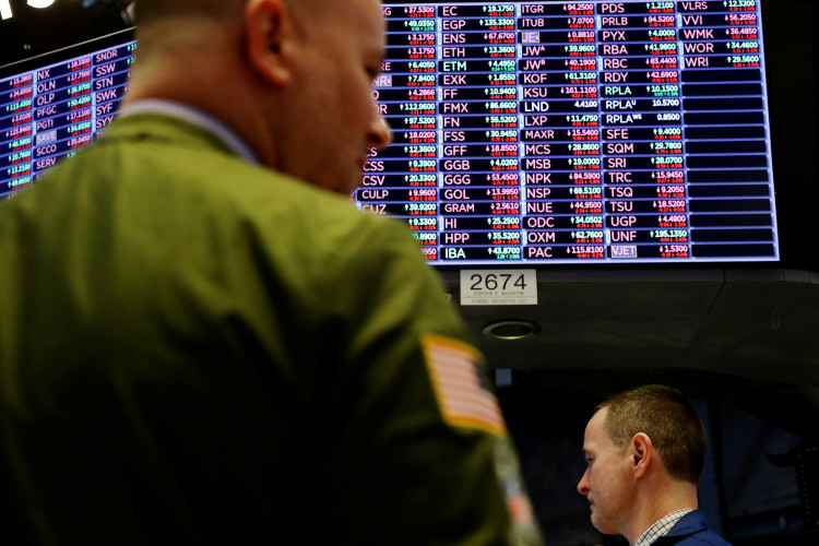 A trader works on the floor of the New York Stock Exchange shortly before the closing bell as the market takes a significant dip