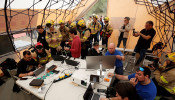 Prometeo monitoring devices (by IBM) are attached to firefighters' suits during prescribed burn of the forest in Olivella