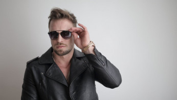 Man in leather wearing black glasses.