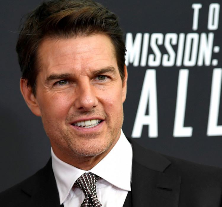FILE PHOTO: Actor Tom Cruise poses for photographers as he arrives on the red carpet for the premiere of Mission:Impossible-Fallout, at the Smithsonian's National Air and Space Museum, in Washington, U.S., July 22, 2018. REUTERS/Mike Theiler/File Photo