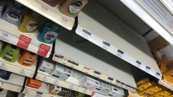 Empty hand sanitizer shelves are pictured at pharmacy Boots, in Birmingham, Britain