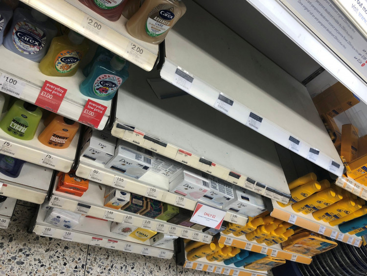 Empty hand sanitizer shelves are pictured at pharmacy Boots, in Birmingham, Britain