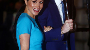 Britain's Prince Harry and his wife Meghan