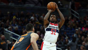 Washington Wizards guard Jordan McRae (52) shoots over Orlando Magic center Nikola Vucevic (9)